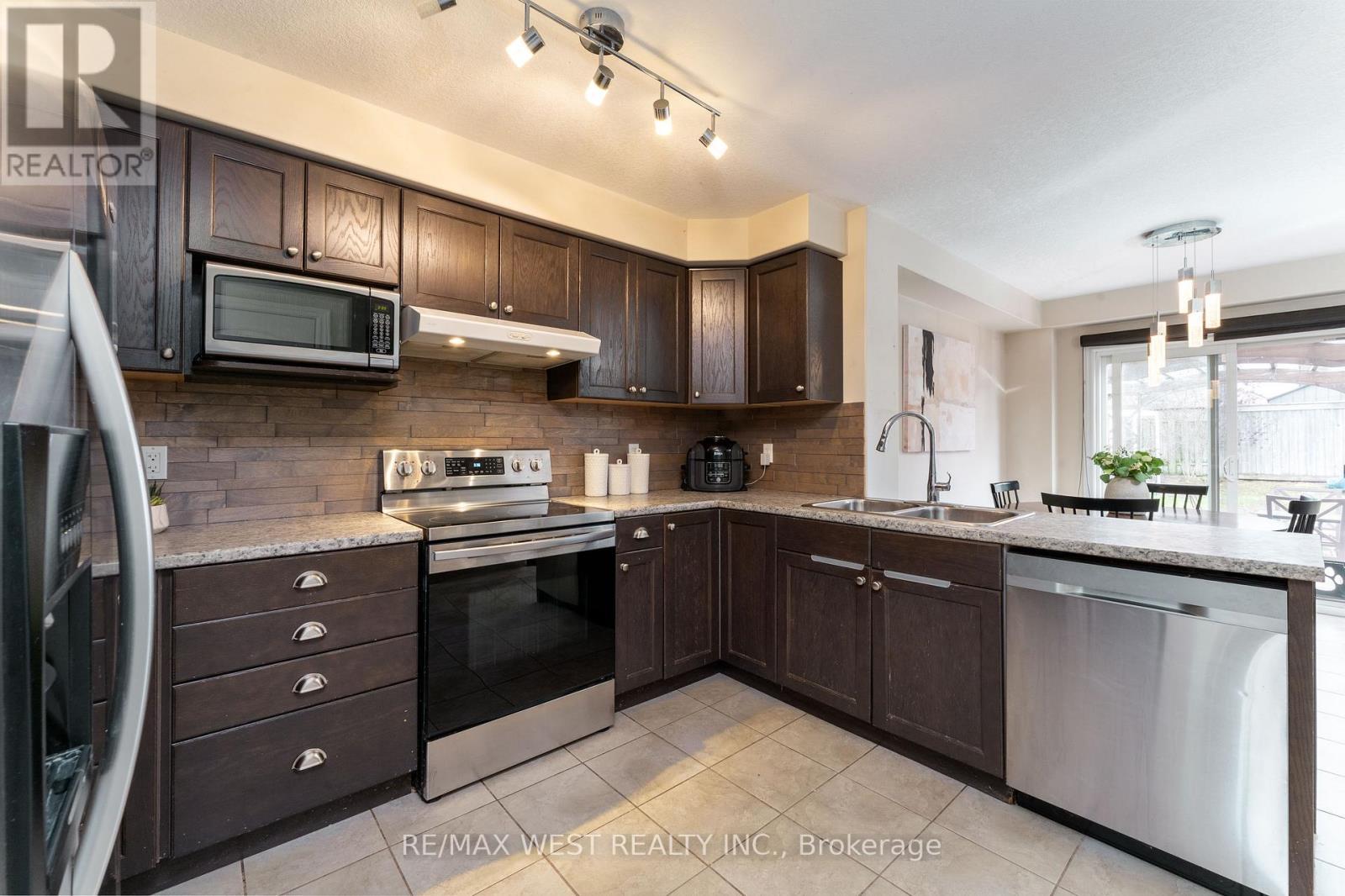 110 Banting Crescent, Essa, ON - Indoor Photo Showing Kitchen With Double Sink