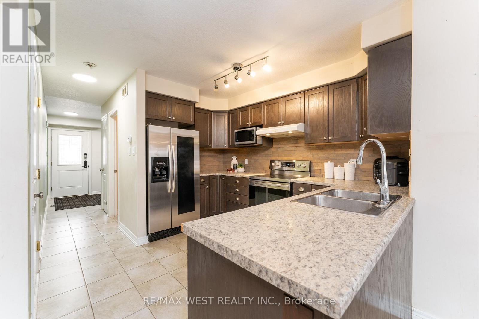 110 Banting Crescent, Essa, ON - Indoor Photo Showing Kitchen With Double Sink