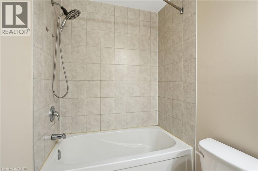Full bath with toilet and shower combination - 91 Chamomile Drive, Hamilton, ON - Indoor Photo Showing Bathroom
