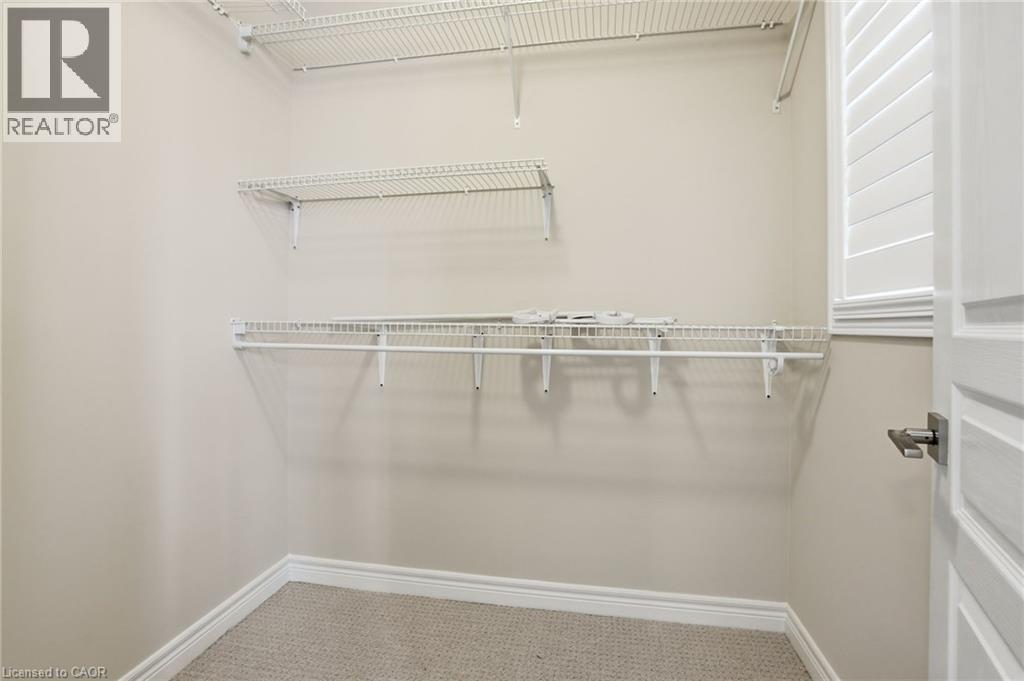 Walk in closet with light colored carpet - 91 Chamomile Drive, Hamilton, ON - Indoor With Storage