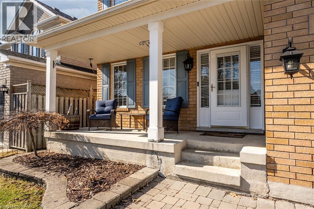 Entrance to property featuring brick siding and a porch - 599 Caverhill Crescent, Milton, ON - Outdoor With Deck Patio Veranda With Exterior