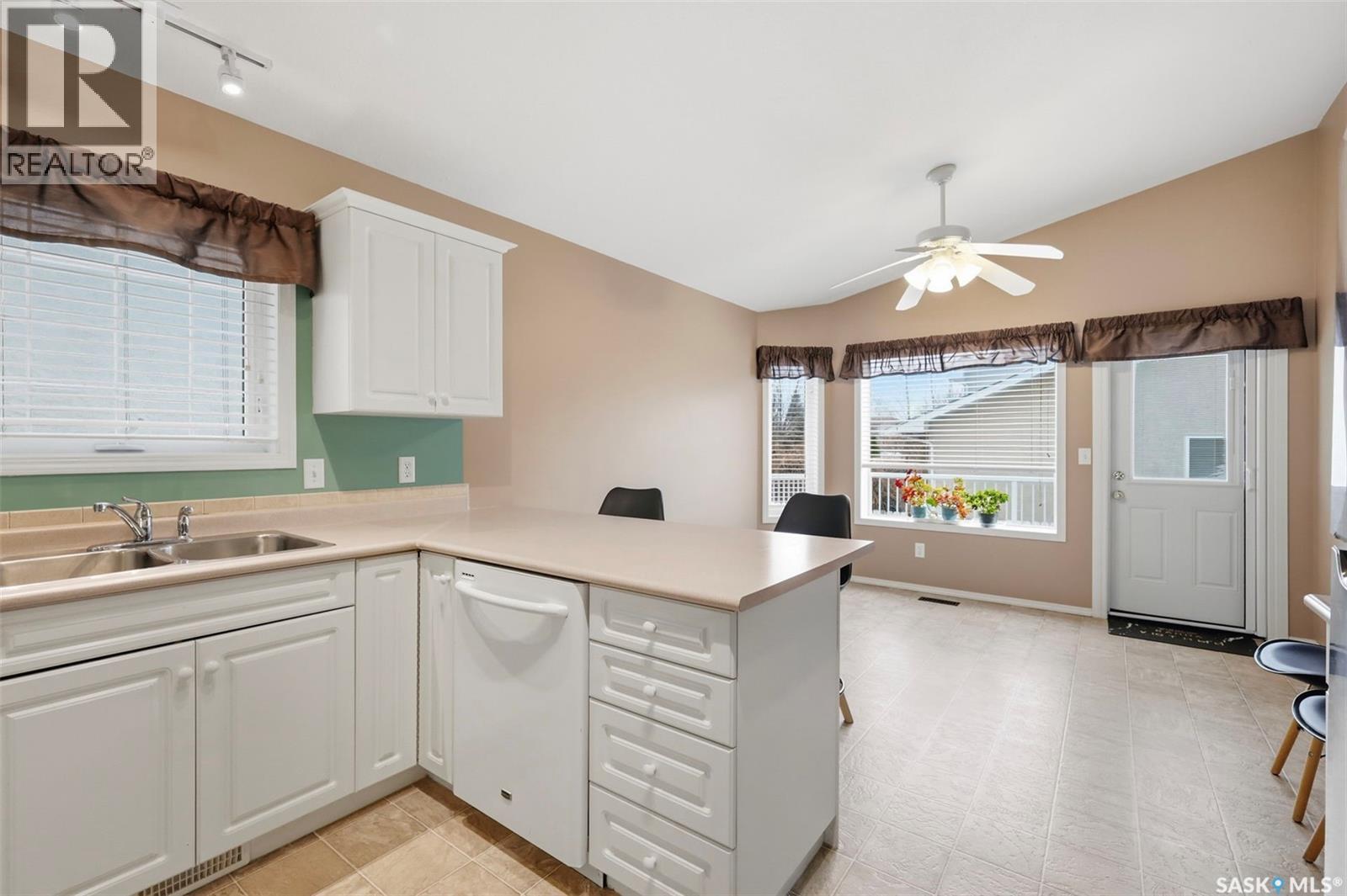 106 Lashyn Cove, Saskatoon, SK - Indoor Photo Showing Kitchen With Double Sink