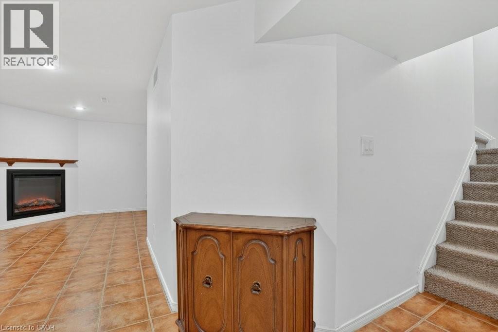 Rec Room - 54 Deerwood Crescent, Kitchener, ON - Indoor Photo Showing Other Room With Fireplace