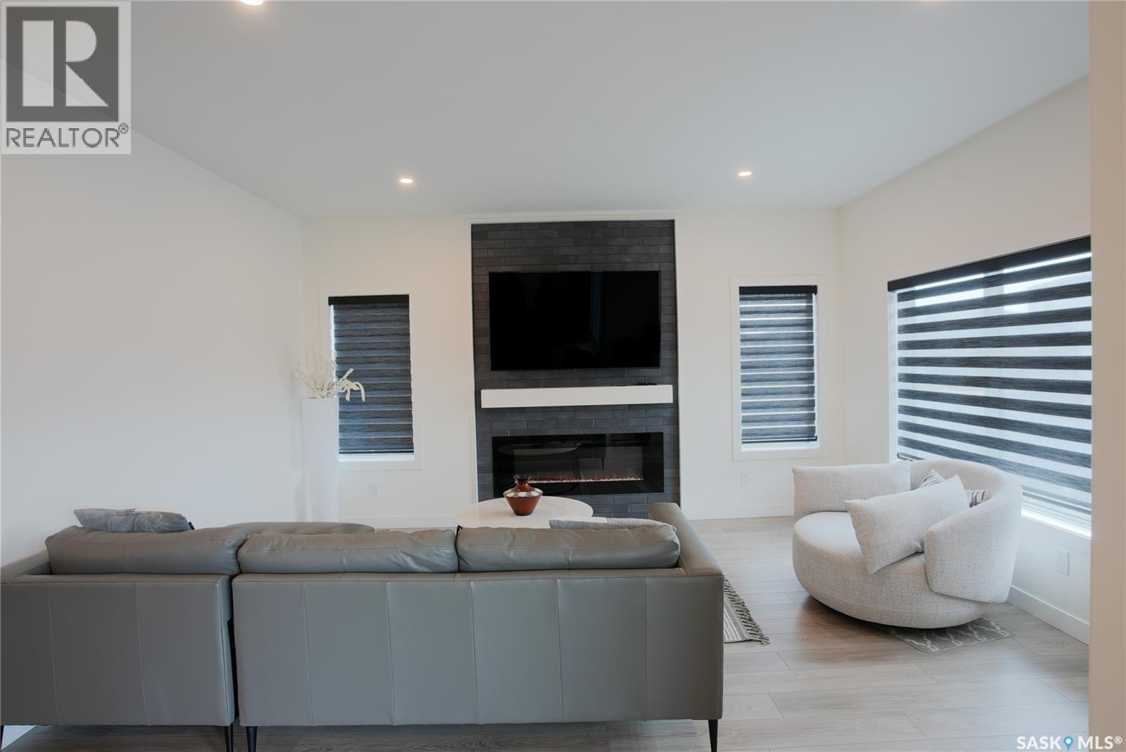 4154 Fieldstone Way, Regina, SK - Indoor Photo Showing Living Room With Fireplace