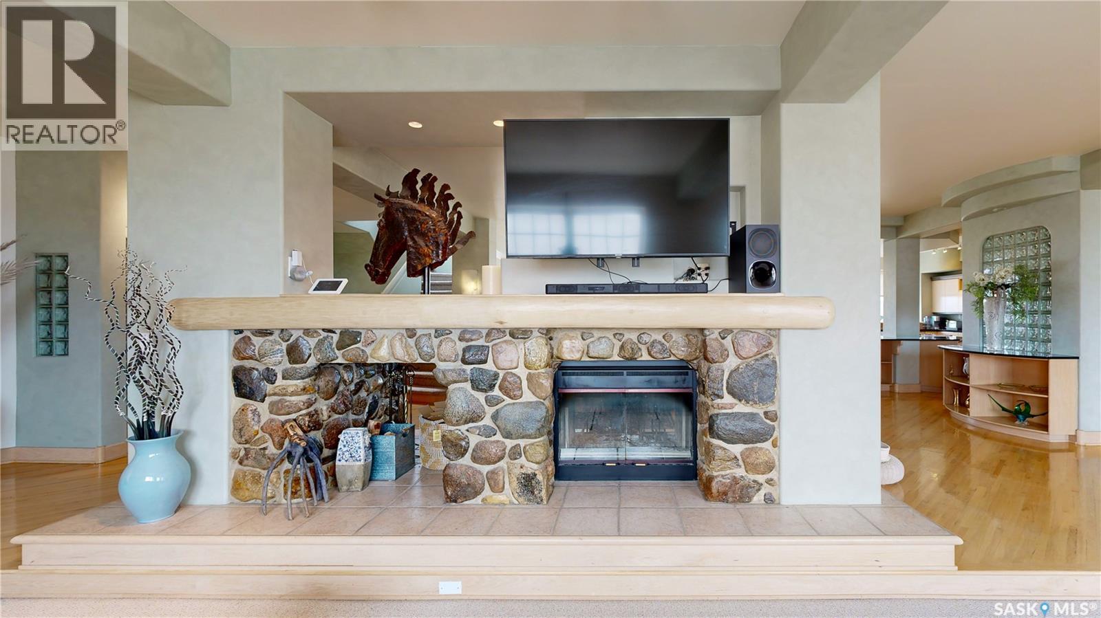 400 1150 Rose Street, Regina, SK - Indoor Photo Showing Living Room With Fireplace