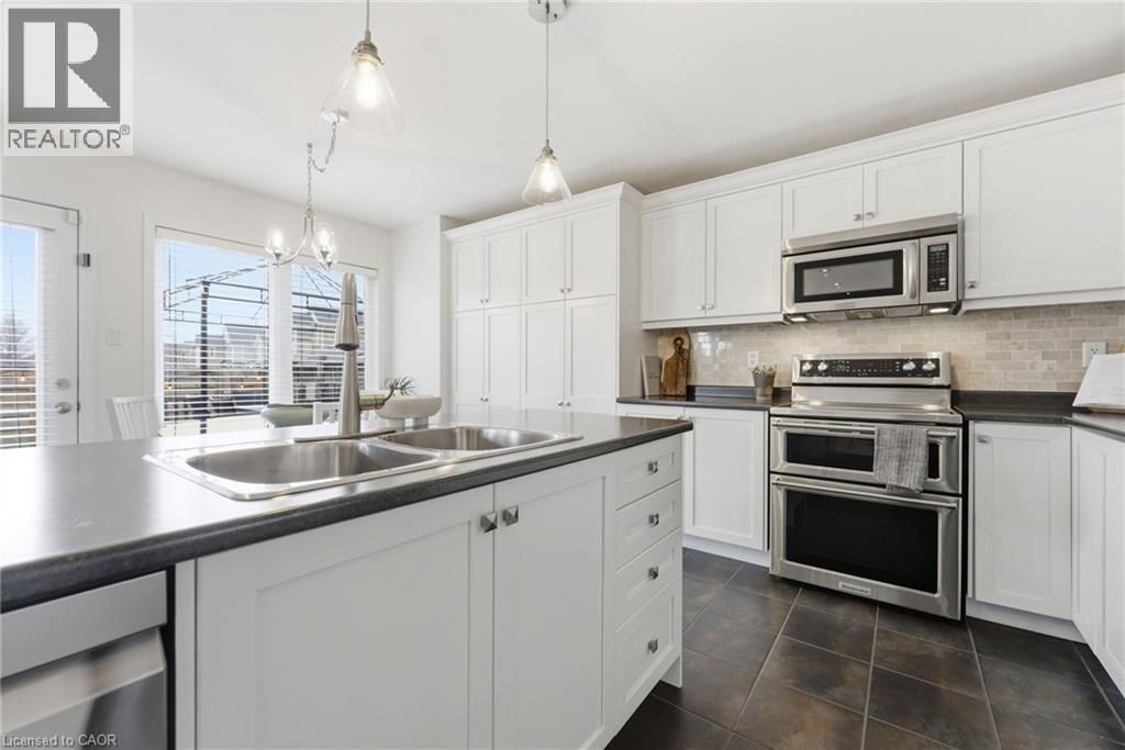 910 Vickerman Way, Milton, ON - Indoor Photo Showing Kitchen With Double Sink