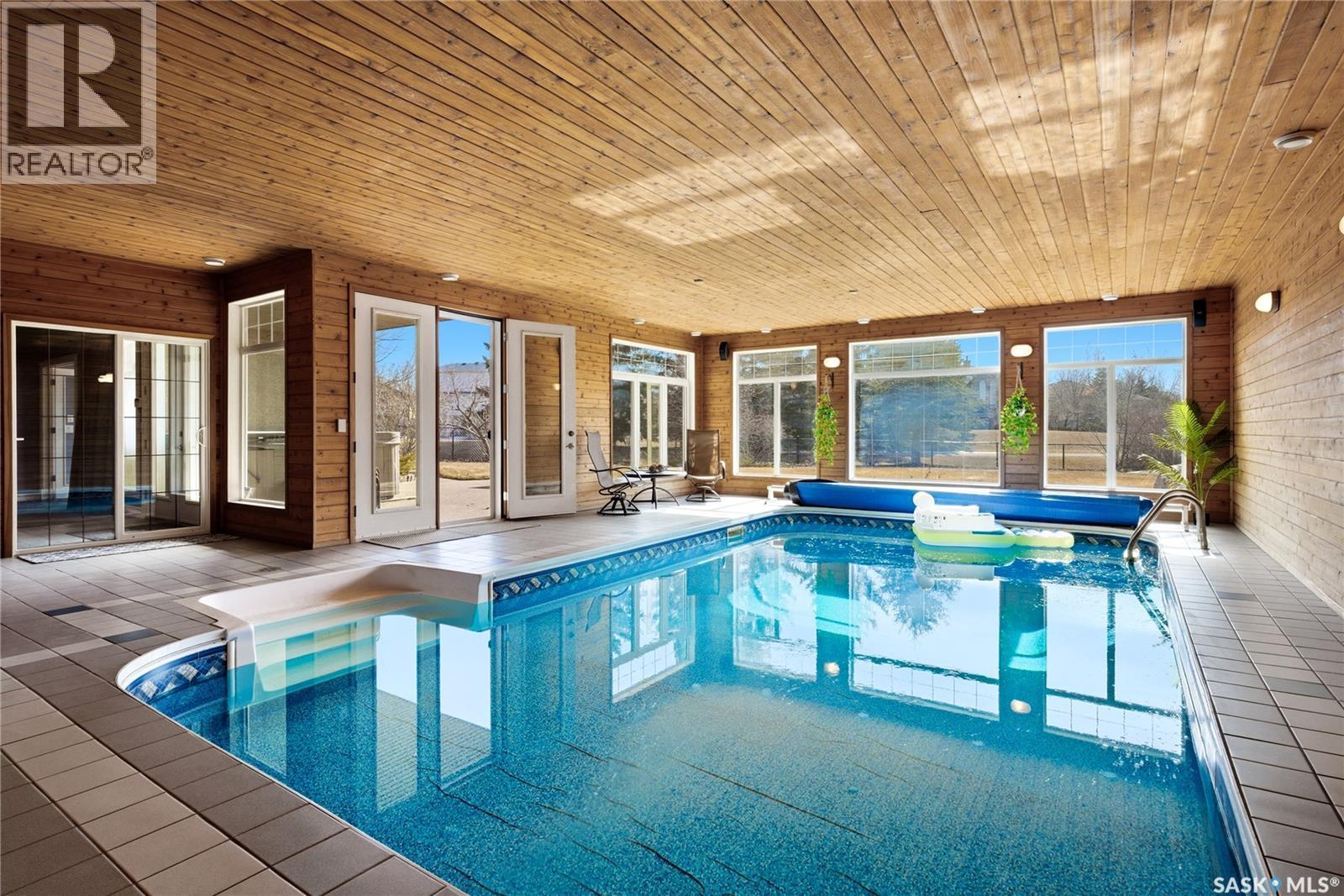 1514 Lakeridge Drive N, Regina, SK - With In Ground Pool With Deck Patio Veranda