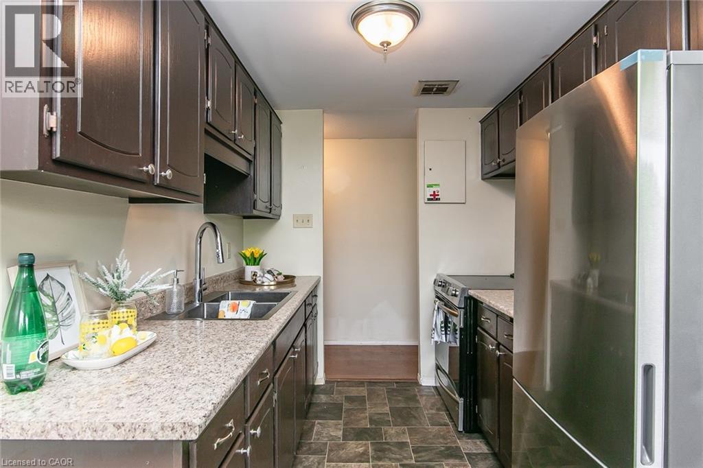 30 Avalon Place Unit# 203, Kitchener, ON - Indoor Photo Showing Kitchen With Double Sink With Upgraded Kitchen