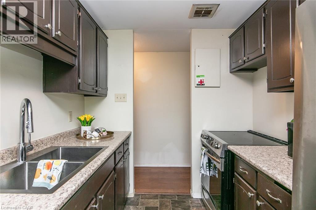 30 Avalon Place Unit# 203, Kitchener, ON - Indoor Photo Showing Kitchen With Double Sink