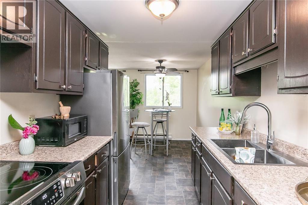30 Avalon Place Unit# 203, Kitchener, ON - Indoor Photo Showing Kitchen With Double Sink With Upgraded Kitchen