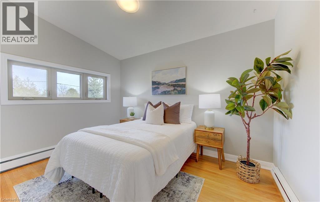 This room features hardwood floors and light gray walls - 400 Manchester Road, Kitchener, ON - Indoor Photo Showing Bedroom