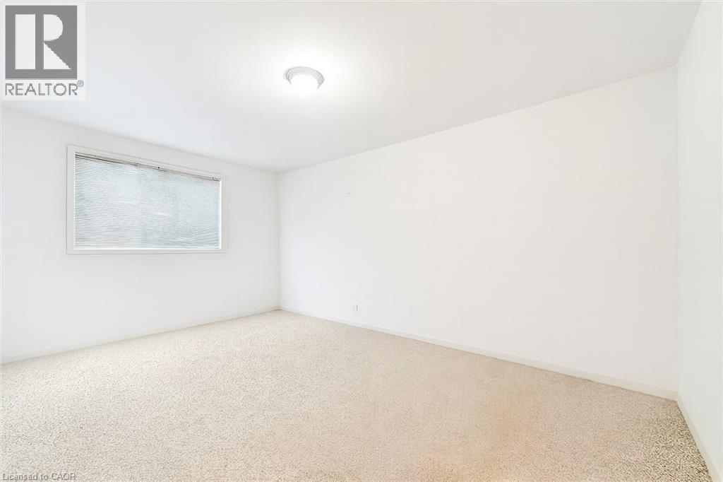 bedroom featuring carpet and baseboards - 21 Arden Avenue, Hamilton, ON
