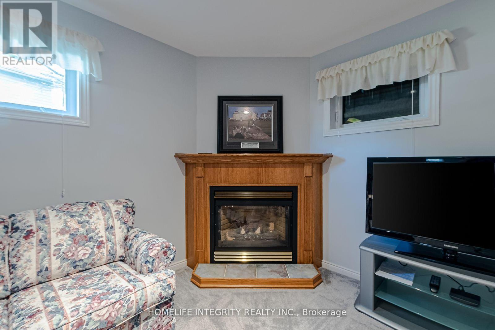 37 Brouwer Crescent, Wasaga Beach, ON - Indoor Photo Showing Living Room With Fireplace