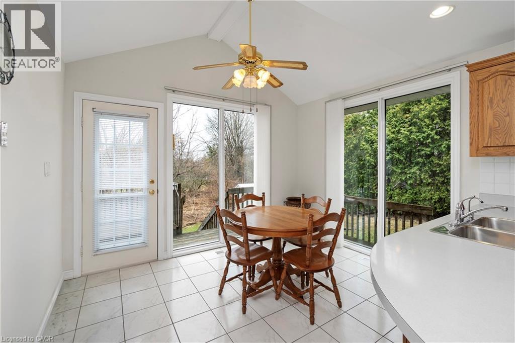 The eat-in kitchen features a vaulted ceiling, a ceiling fan, and tiled flooring - 36 Buckingham Drive, Hamilton, ON - Indoor Photo Showing Dining Room