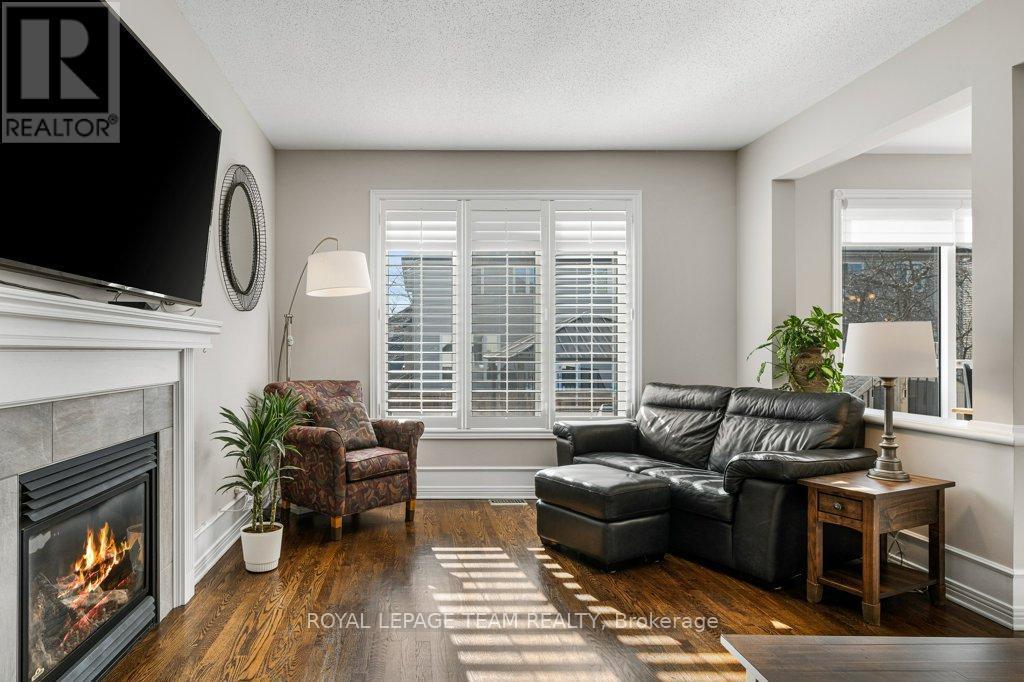 8 Thunderbird Crescent, Ottawa, ON - Indoor Photo Showing Living Room With Fireplace