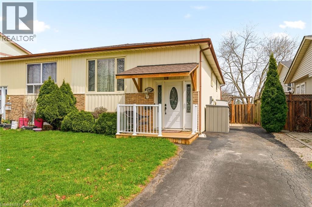 The property features a well-maintained front lawn and a paved driveway - 2349 Middlesmoor Crescent, Burlington, ON - Outdoor