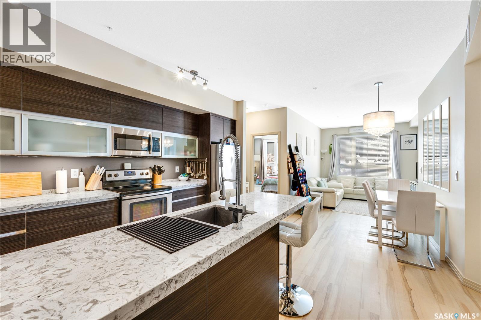 104 223 Evergreen Square, Saskatoon, SK - Indoor Photo Showing Kitchen With Stainless Steel Kitchen With Double Sink With Upgraded Kitchen