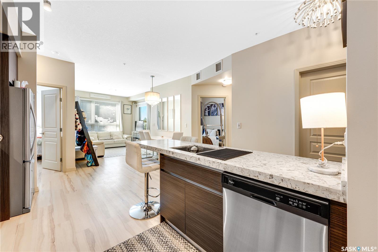 104 223 Evergreen Square, Saskatoon, SK - Indoor Photo Showing Kitchen With Double Sink