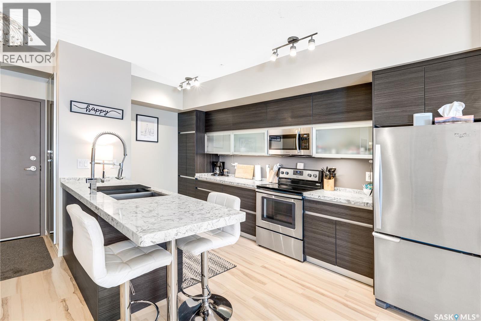 104 223 Evergreen Square, Saskatoon, SK - Indoor Photo Showing Kitchen With Stainless Steel Kitchen With Double Sink