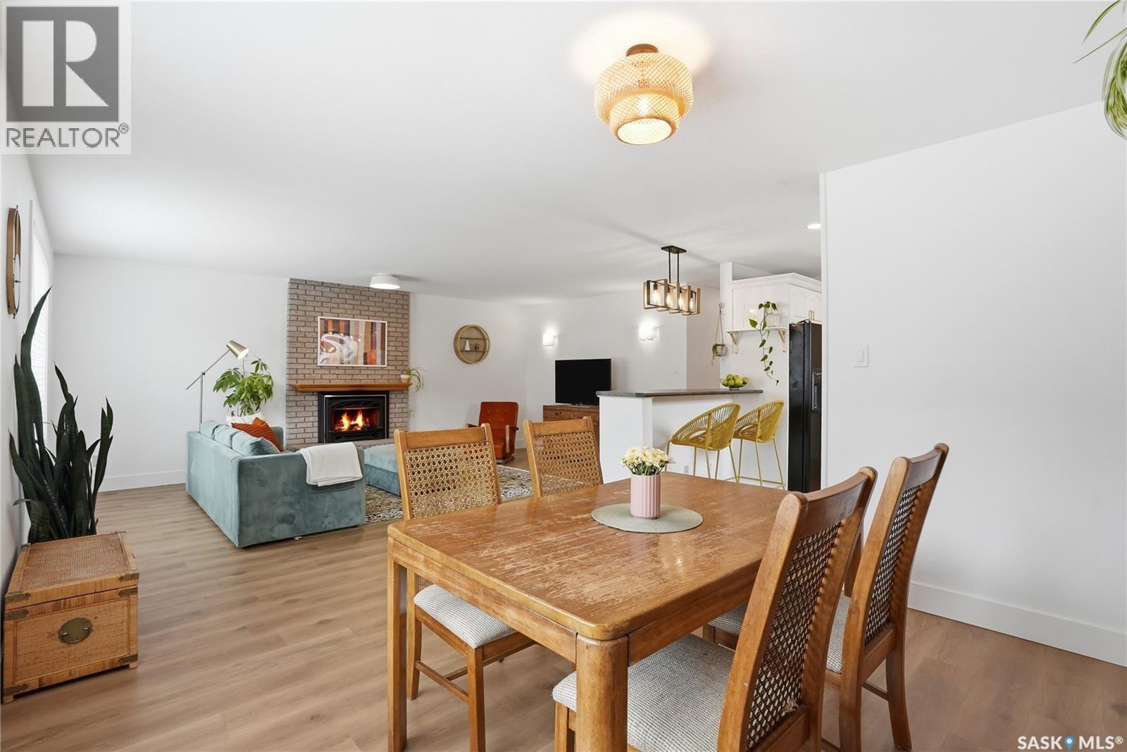 418 Pinehouse Drive, Saskatoon, SK - Indoor Photo Showing Dining Room With Fireplace