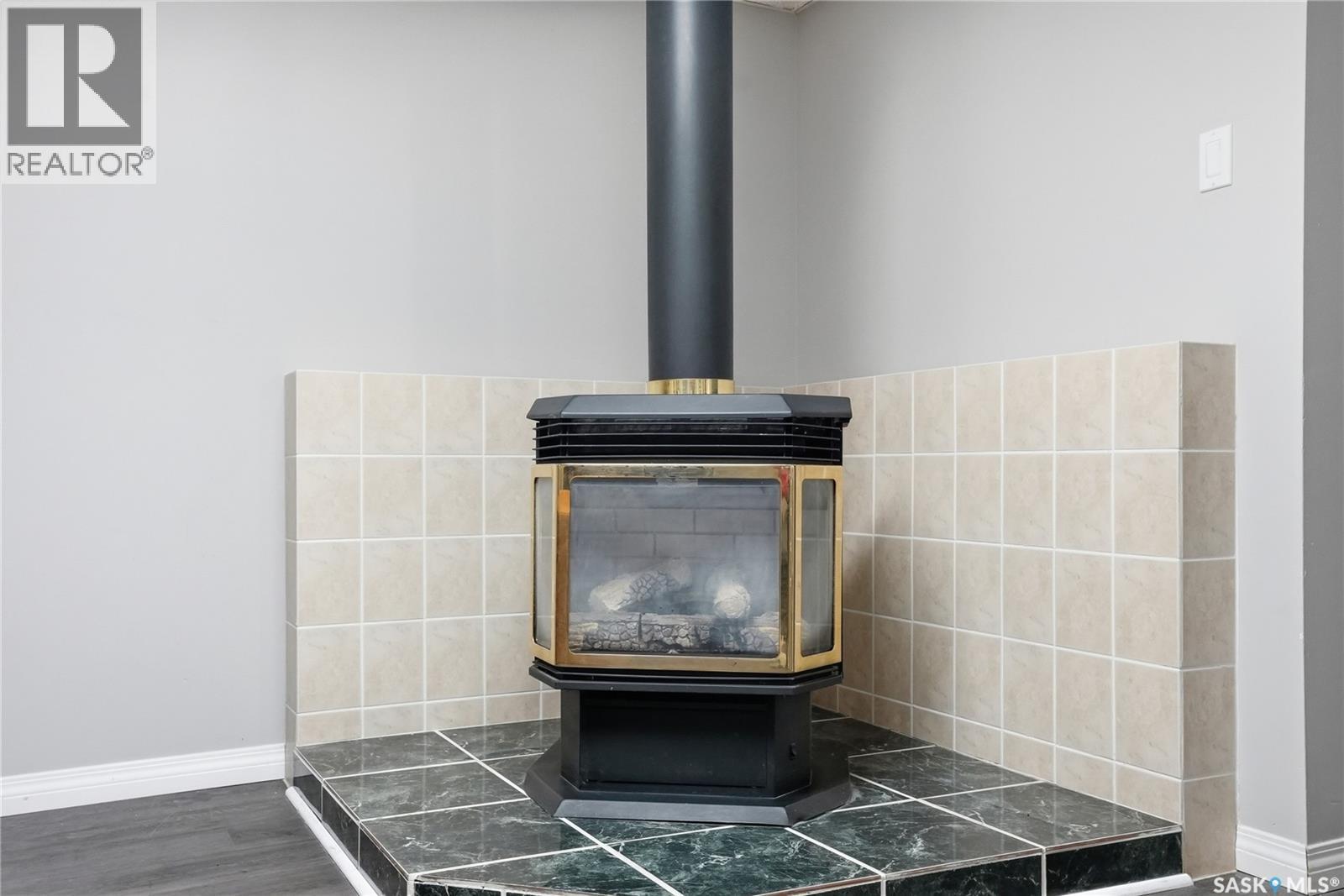 418 Pinehouse Drive, Saskatoon, SK - Indoor Photo Showing Other Room With Fireplace