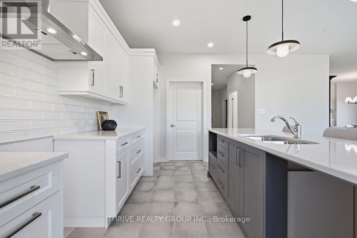 64 Basil Crescent, Middlesex Centre (Ilderton), ON - Indoor Photo Showing Kitchen With Upgraded Kitchen