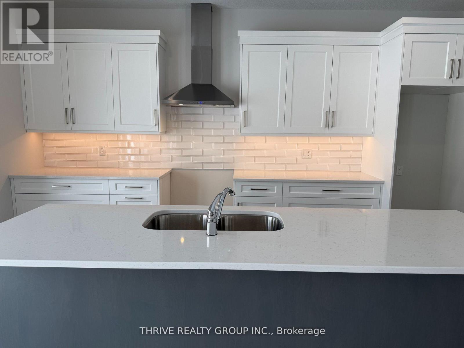 64 Basil Crescent, Middlesex Centre (Ilderton), ON - Indoor Photo Showing Kitchen With Double Sink