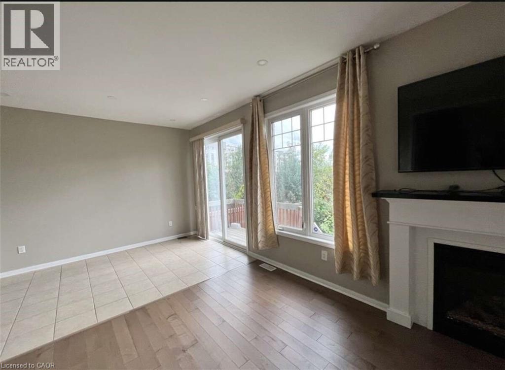 450 Cavanagh Lane, Milton, ON - Indoor Photo Showing Living Room With Fireplace