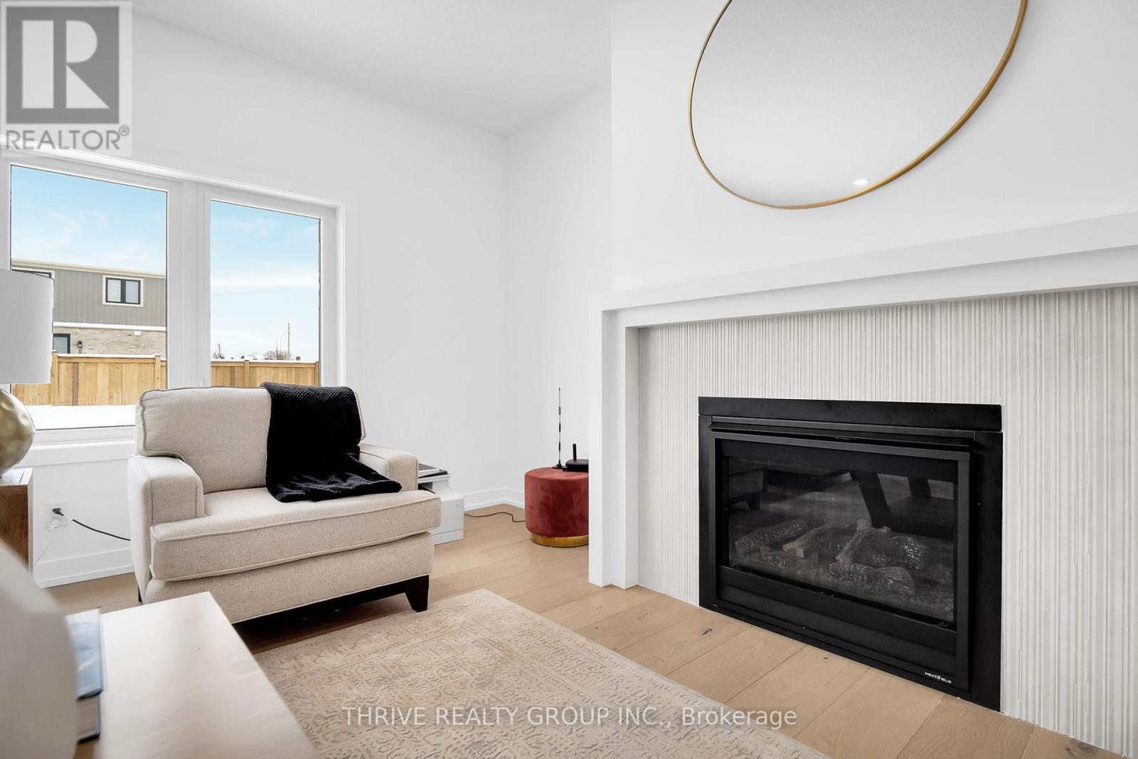 3 Basil Crescent, Middlesex Centre (Ilderton), ON - Indoor Photo Showing Living Room With Fireplace