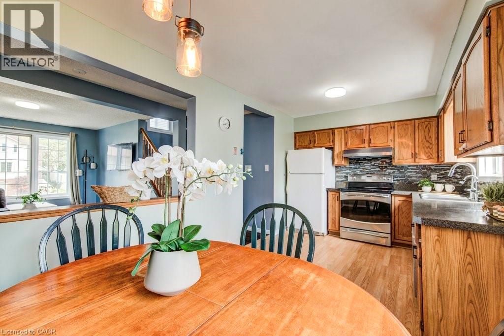 Dining space with light wood-type flooring - 633 Grange Crescent, Waterloo, ON - Indoor