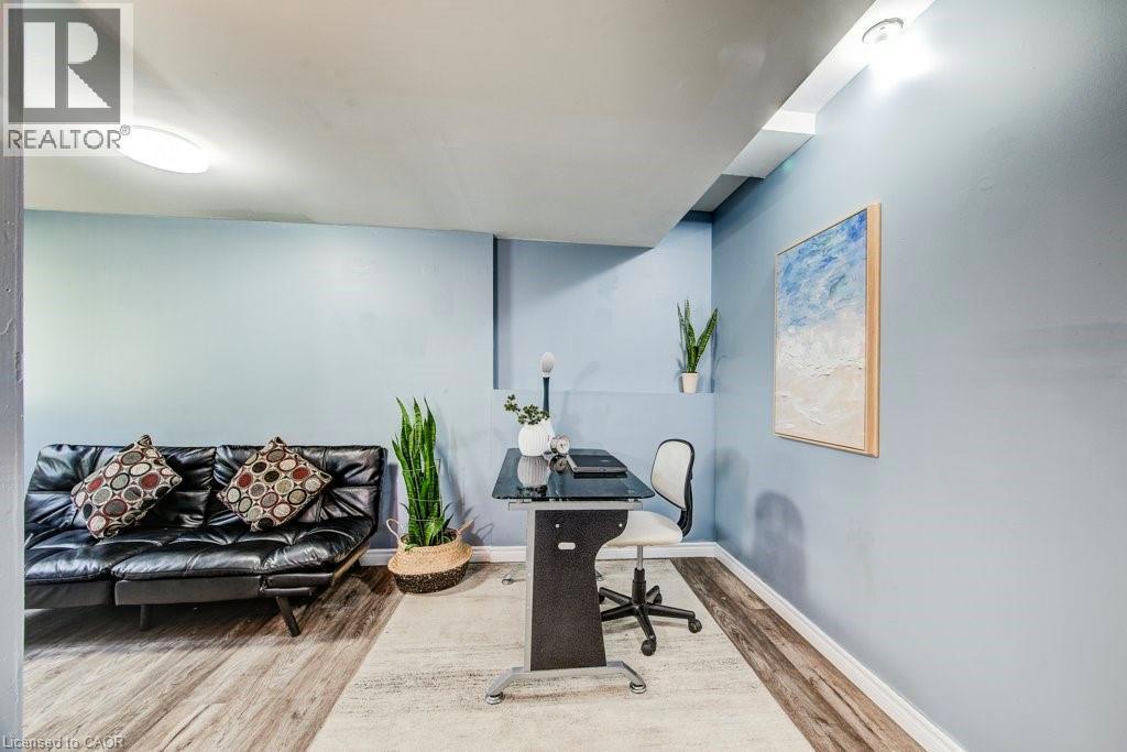 Office area featuring wood finished floors - 633 Grange Crescent, Waterloo, ON - Indoor
