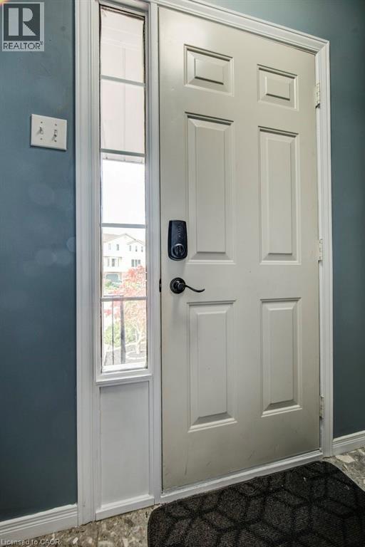 Entryway featuring baseboards - 633 Grange Crescent, Waterloo, ON - Indoor Photo Showing Other Room