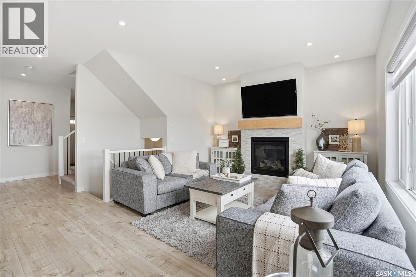 342 Stilling Manor, Saskatoon, SK - Indoor Photo Showing Living Room With Fireplace