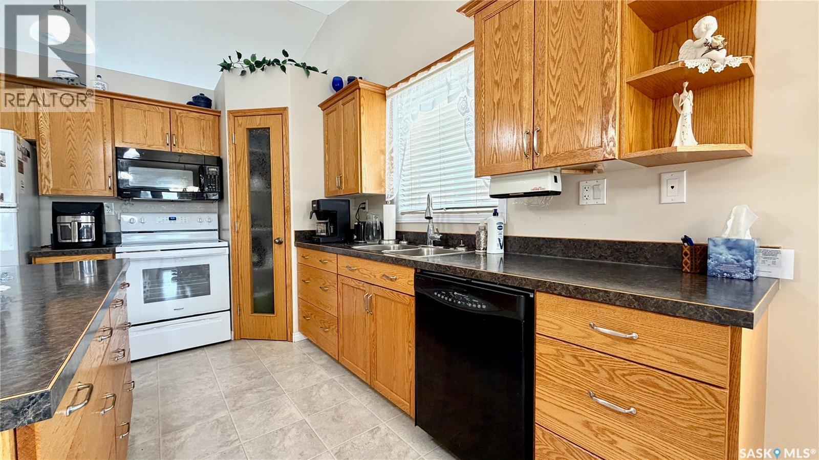 15B Downing Drive, Lanigan, SK - Indoor Photo Showing Kitchen With Double Sink