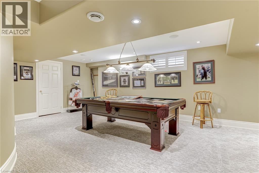 Recreation room featuring a pool table, carpeted flooring, recessed lighting, and a window with white shutters - 4278 Clubview Drive, Burlington, ON - Indoor Photo Showing Other Room
