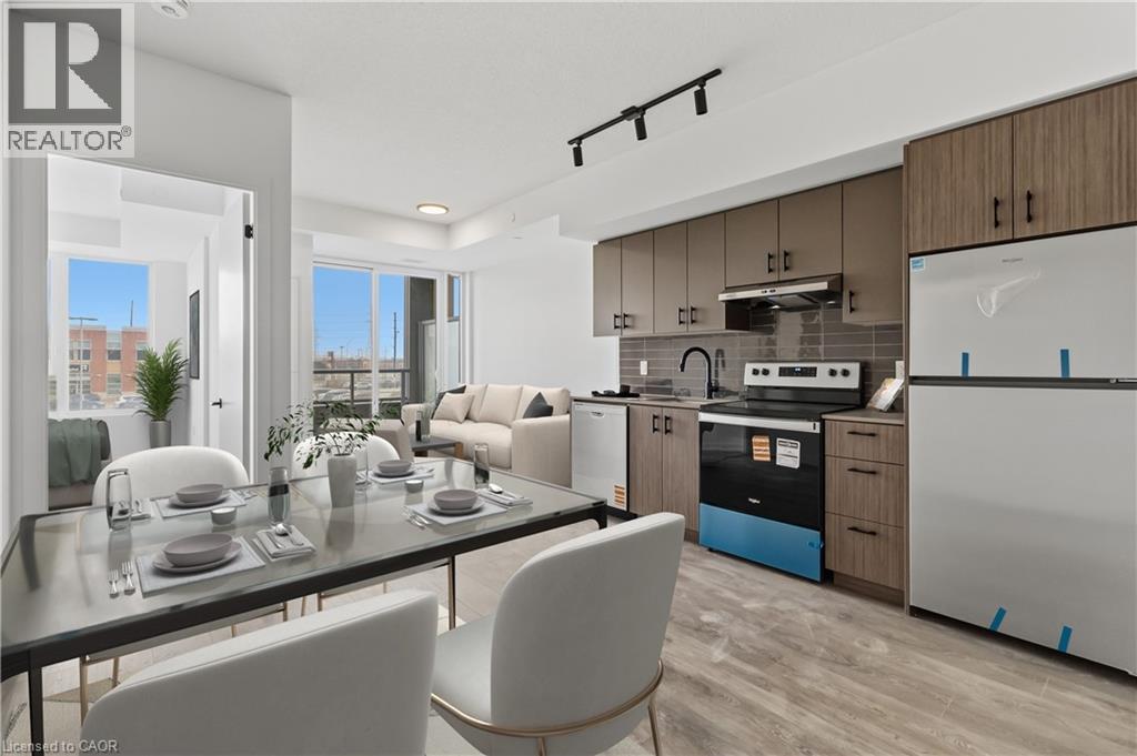 The open-concept living space features a modern kitchen with wood-look cabinetry and stainless steel appliances - 4878 Powers Common Unit# 224, Burlington, ON - Indoor