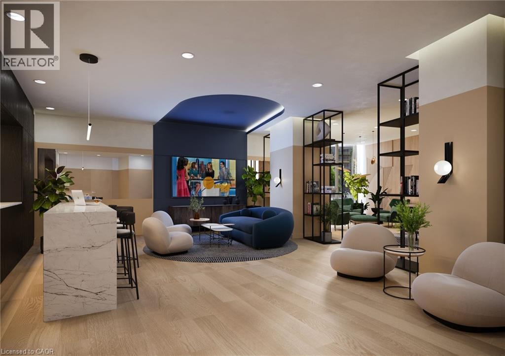 The property features light-toned wood flooring, a striking marble-clad island with seating, recessed lighting, and modern wall sconces - 4878 Powers Common Unit# 224, Burlington, ON - Indoor