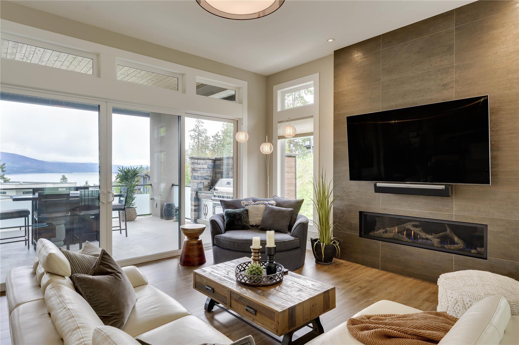 3303 Water Birch Circle, Kelowna, BC - Indoor Photo Showing Living Room With Fireplace