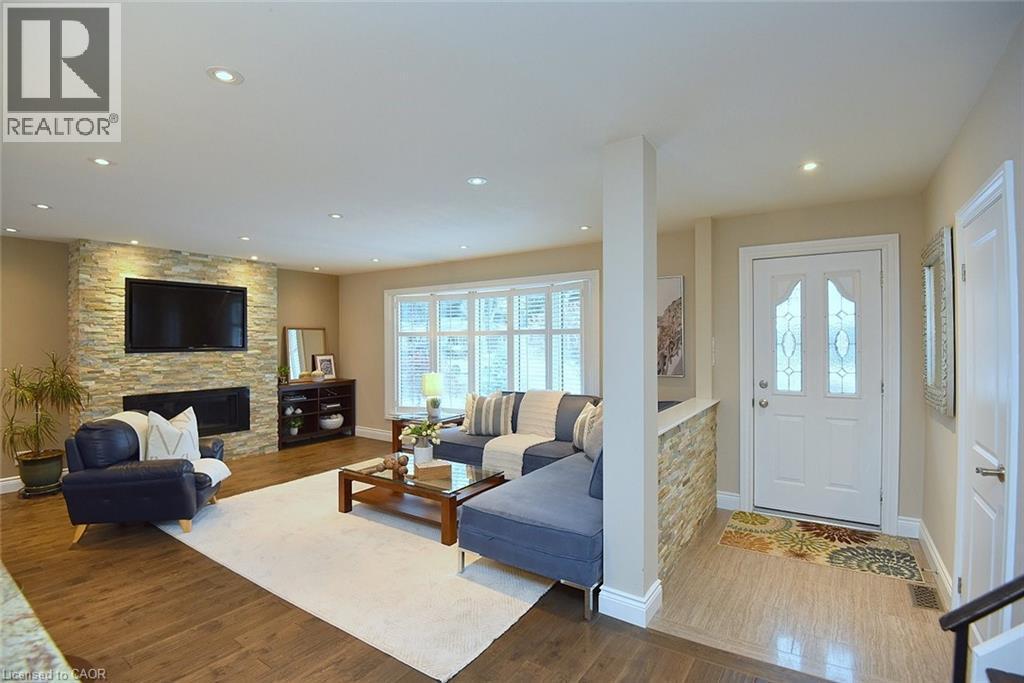 Plenty of natural light - 626 Vanderburgh Drive, Burlington, ON - Indoor Photo Showing Living Room With Fireplace