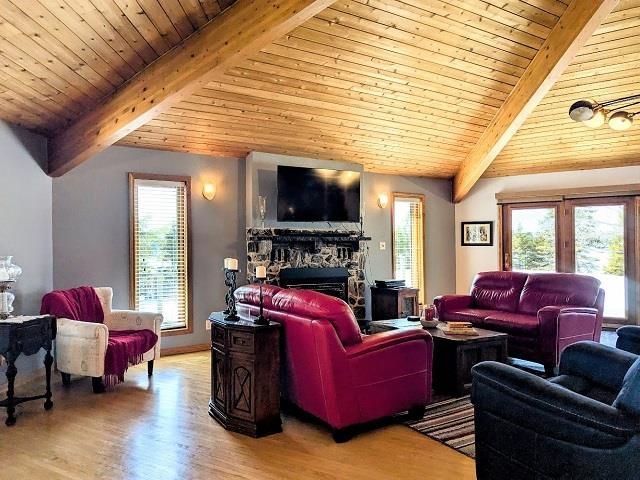 293 Ross Lapointe Road, Oxdrift, ON - Indoor Photo Showing Living Room With Fireplace