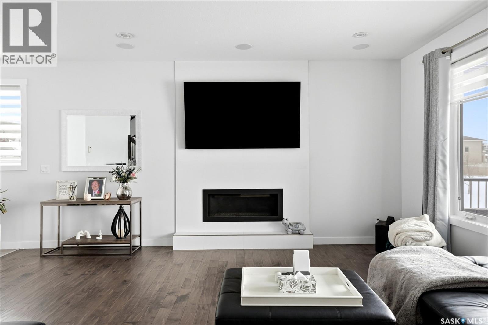 5237 Snowbirds Crescent, Regina, SK - Indoor Photo Showing Living Room With Fireplace