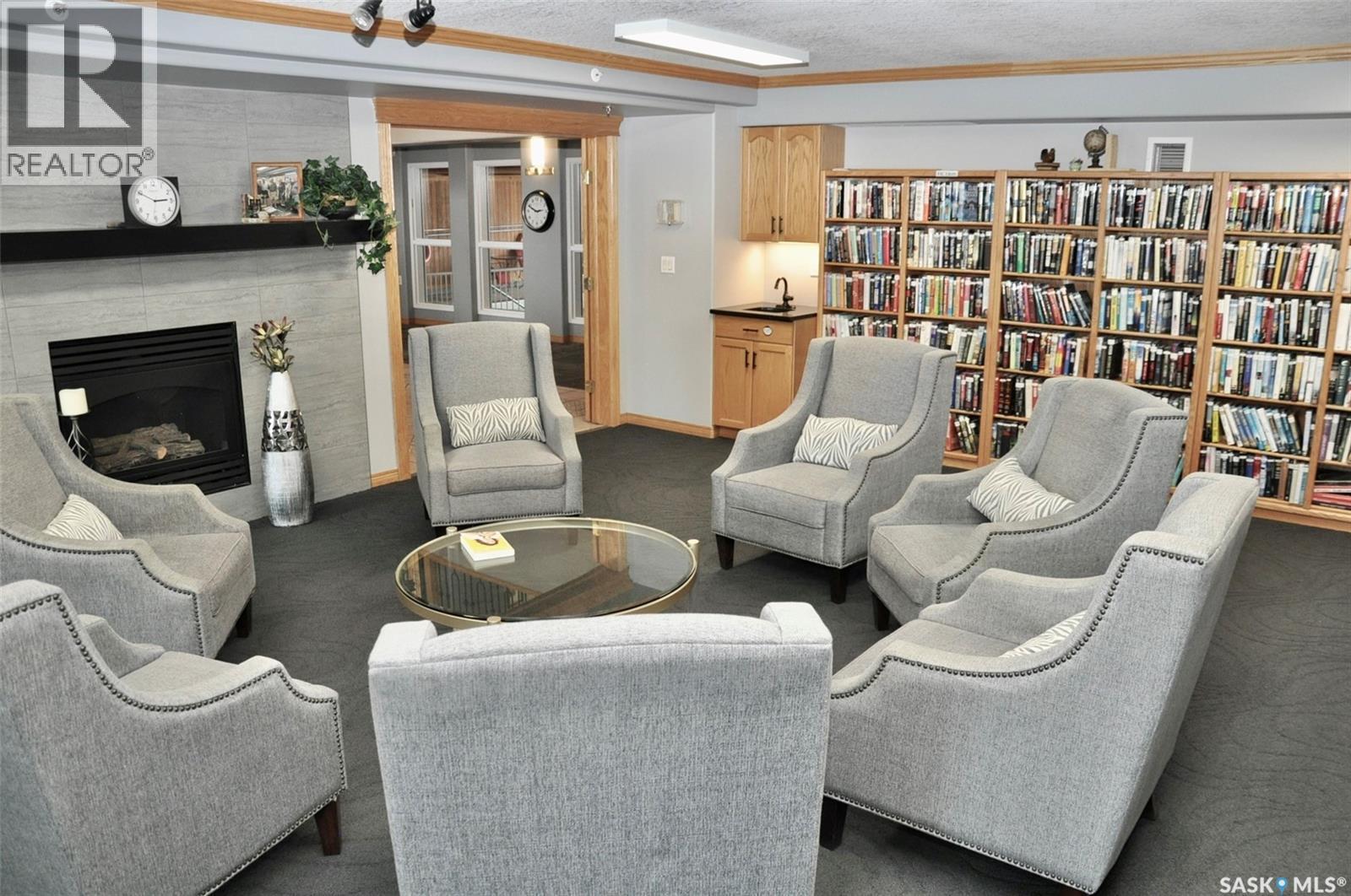 317 325 Keevil Crescent, Saskatoon, SK - Indoor Photo Showing Living Room With Fireplace