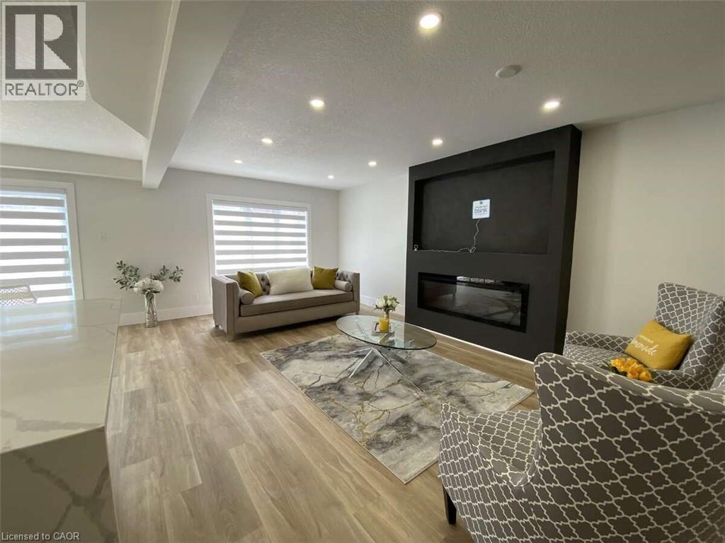 125 Steepleridge Street, Kitchener, ON - Indoor Photo Showing Living Room With Fireplace