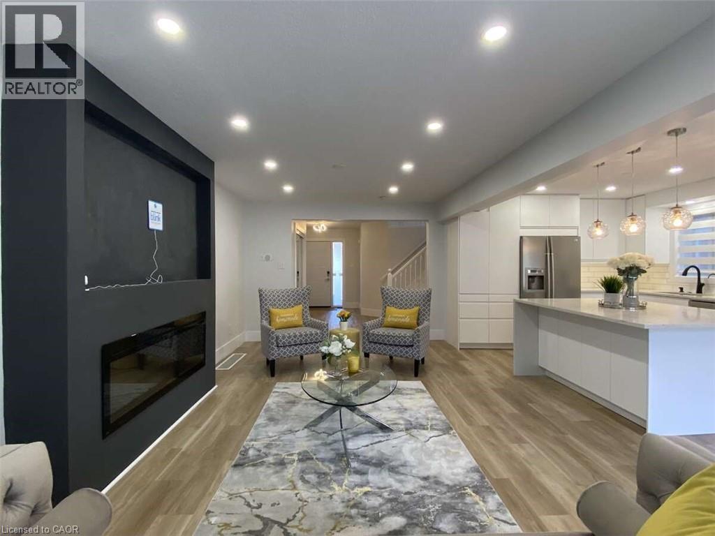 125 Steepleridge Street, Kitchener, ON - Indoor Photo Showing Living Room With Fireplace
