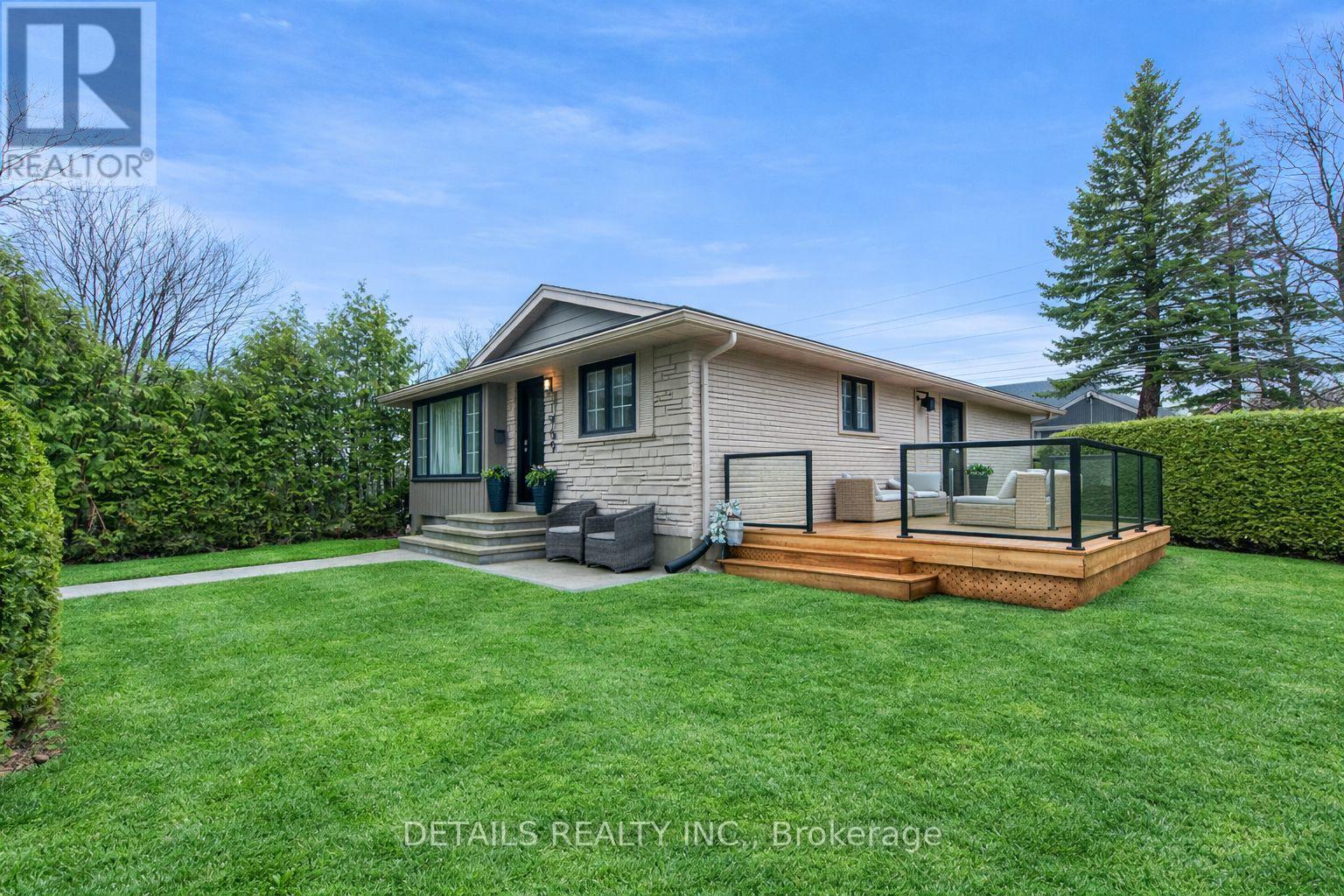 This photo has been AI altered to show green grass - 1969 Sharel Drive, Ottawa, ON - Outdoor With Deck Patio Veranda