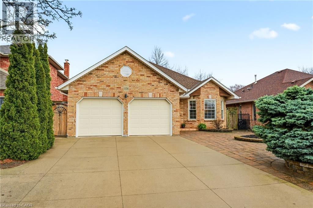 Concrete Driveway & Double Garage. - 1156 Augustus Drive, Burlington, ON - Outdoor With Facade