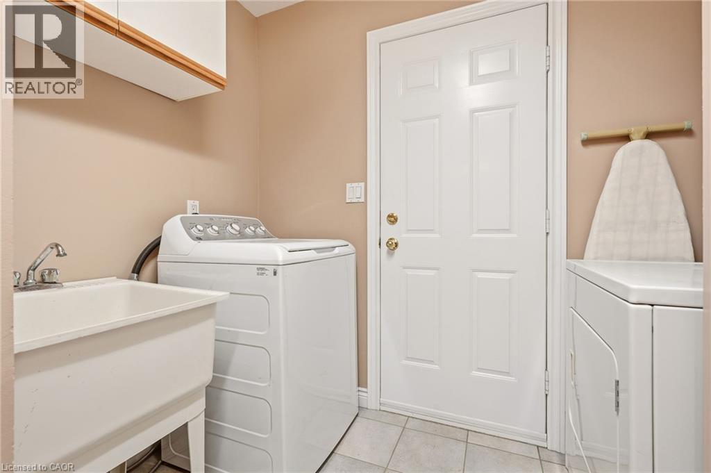 Convenient Main Floor Laundry w/Garage Entry - 1156 Augustus Drive, Burlington, ON - Indoor Photo Showing Laundry Room