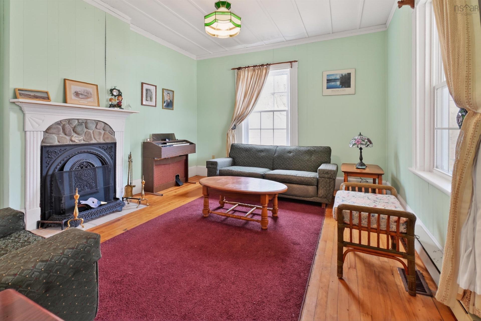 2145 Marble Mountain Rd, West Bay, NS - Indoor Photo Showing Living Room With Fireplace