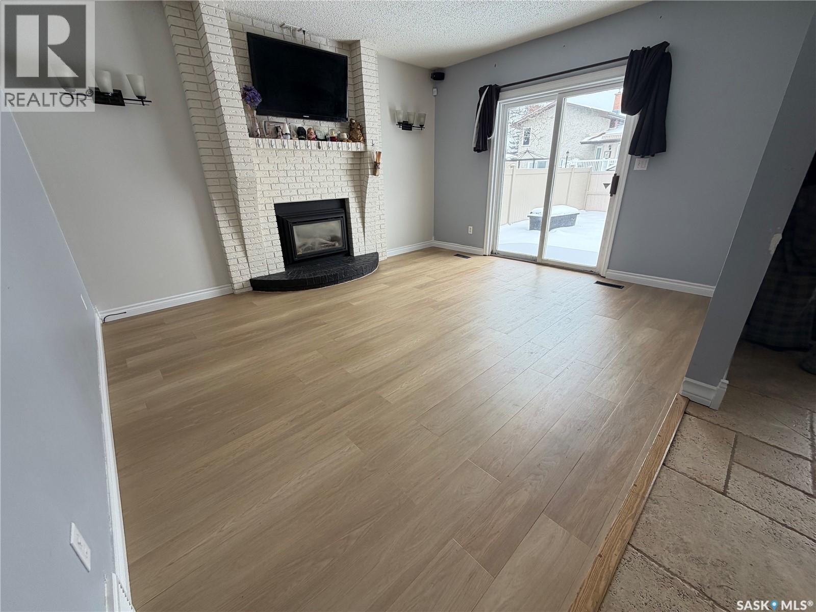 2102 Truesdale Drive E, Regina, SK - Indoor Photo Showing Other Room With Fireplace