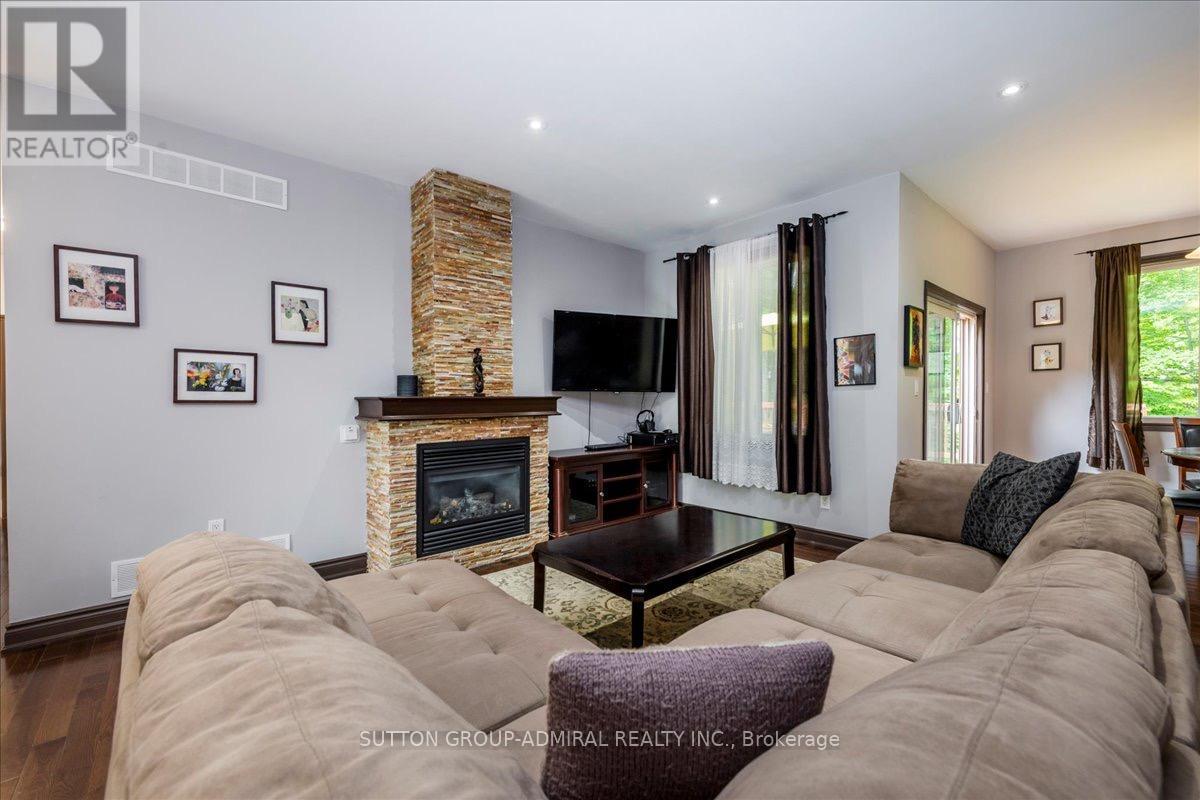 79 Forest Circle, Tiny, ON - Indoor Photo Showing Living Room With Fireplace